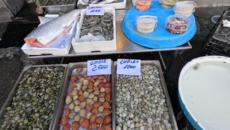 fresh seafood displayed at a market stall