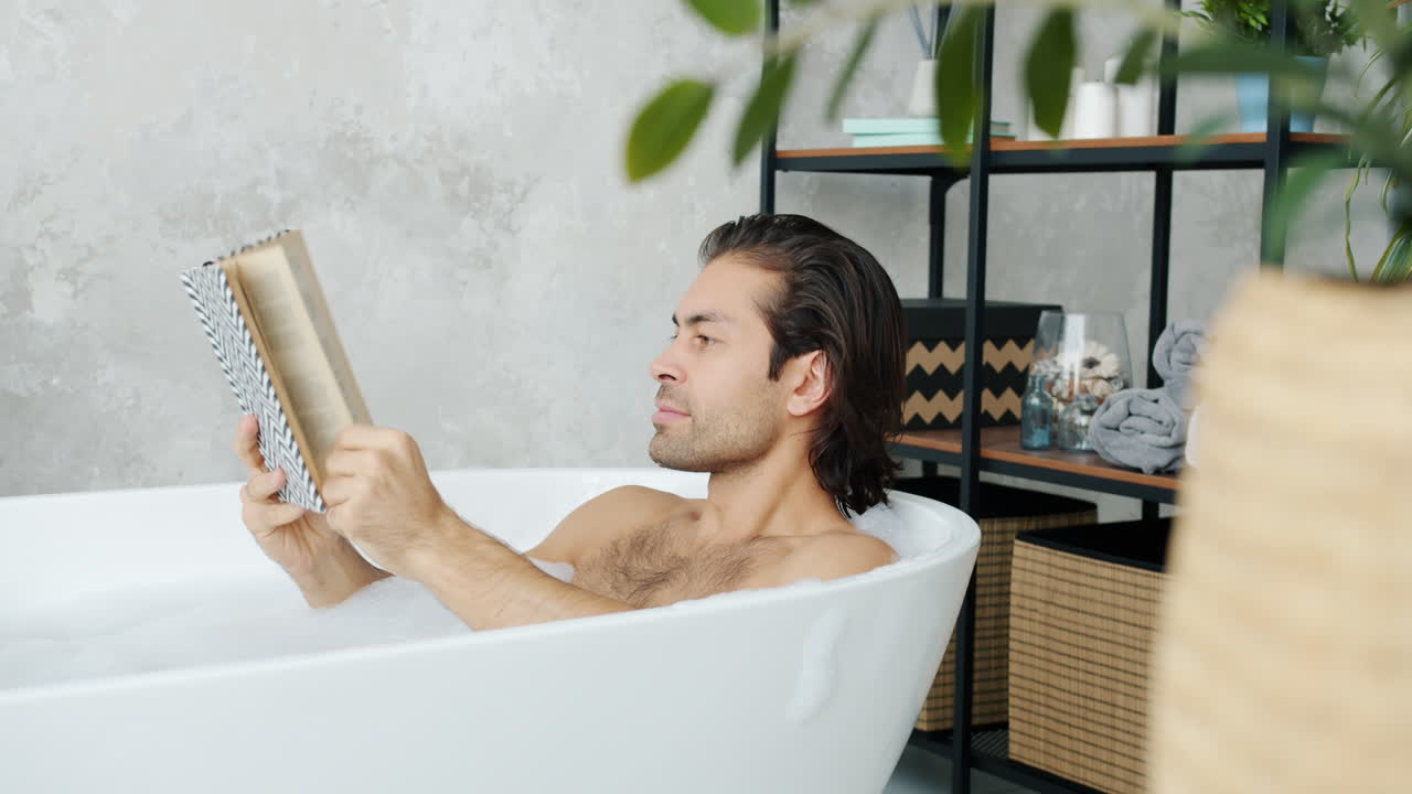 Man Reading in a Bathtub