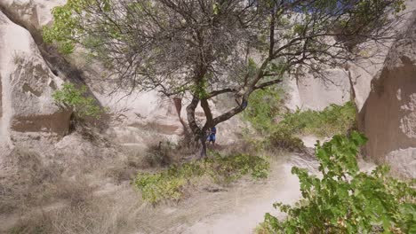 Female-hiker-explores-Rose-Red-valley-trail-Cappadoccia-sunny-day