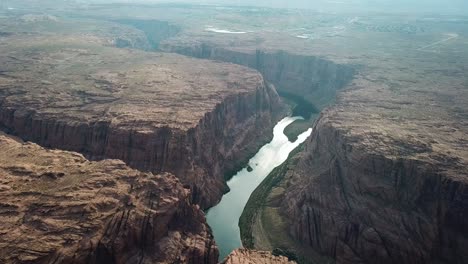 aerial view of scenic colorado river canyon with sandstone cliffs on horseshoe bend, arizona usa