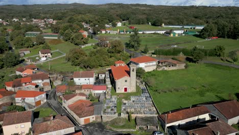 drone shot of santa maría de parada de outeiro church and surroundings in vilar de santos, spain