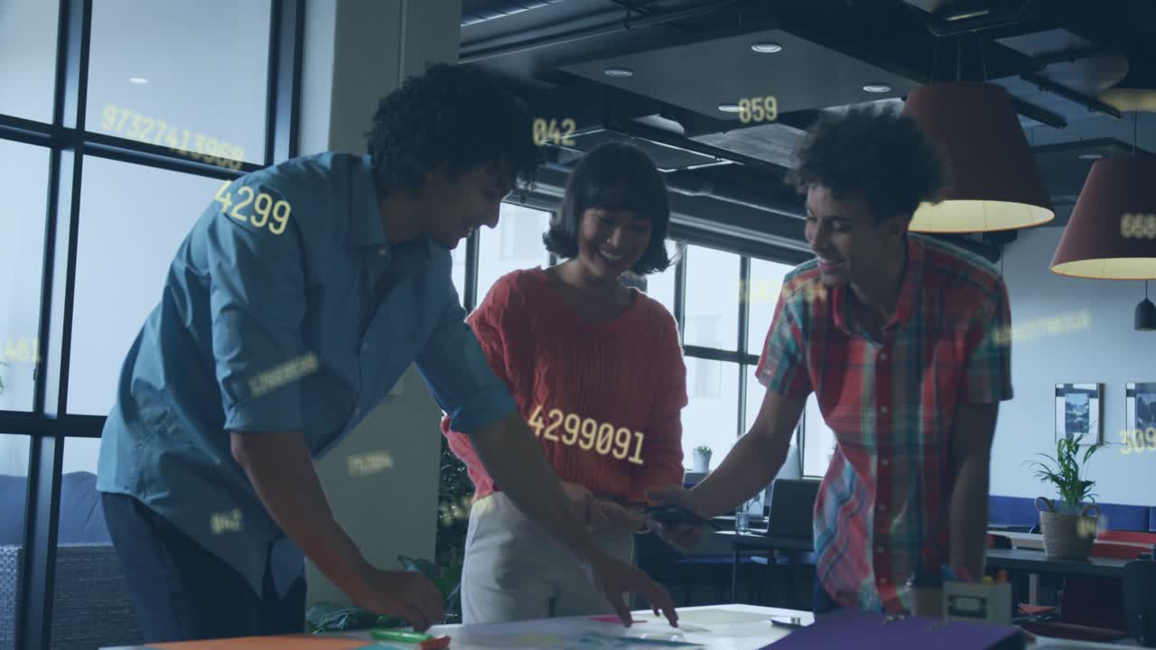 Design team sorting docs at table right man showing phone numeric over docs react then resuming