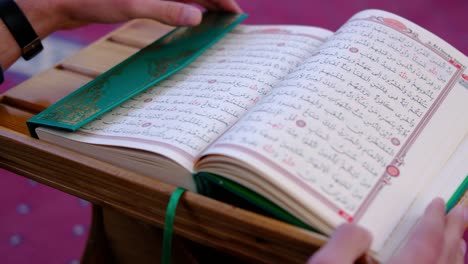 Man Holds and Reads the Quran