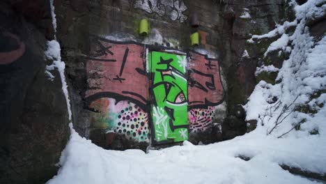 entrance of an old ammunition cave covered in graffiti