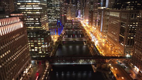 aerial view of the chicago loop at night. shot along the chicago river.