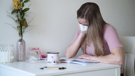 a young girl reads a letter from her lover in her apartment