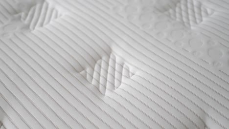 close-up of a white quilted mattress