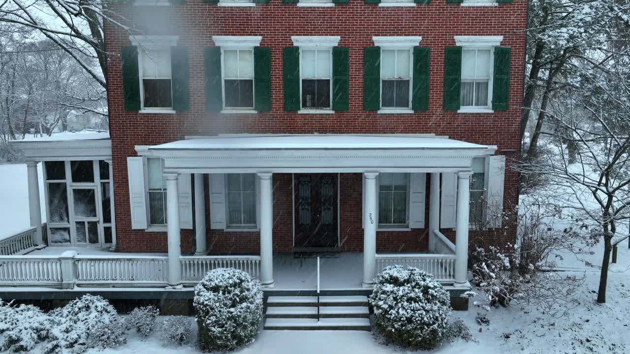 Historic Brick House Covered in Winter Snow