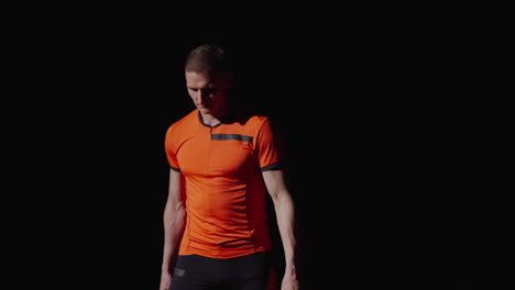 athlete in orange jersey