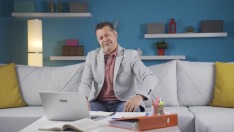 home office worker man looking annoyed at camera.