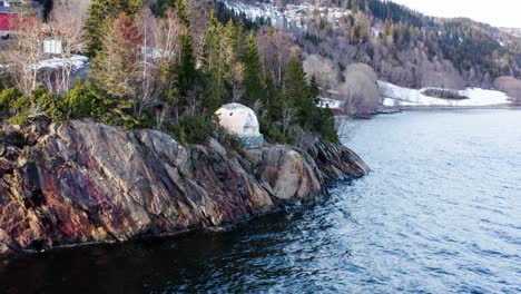 norwegian arctic dome accommodation overlooking the sea