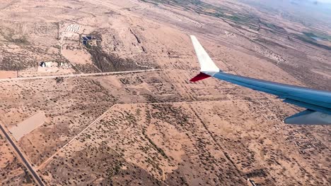 shot of sonora desert through airplane window near hermosillo