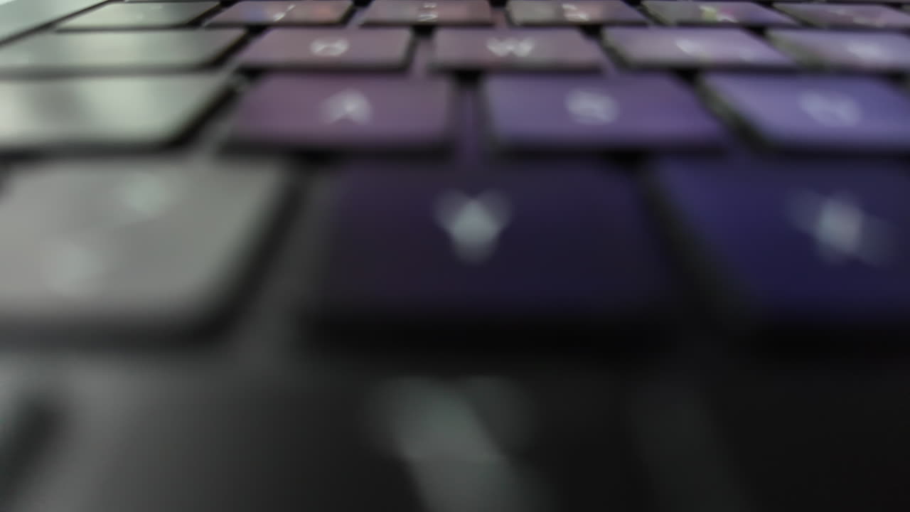 Laptop keyboard close-up, with blurred details