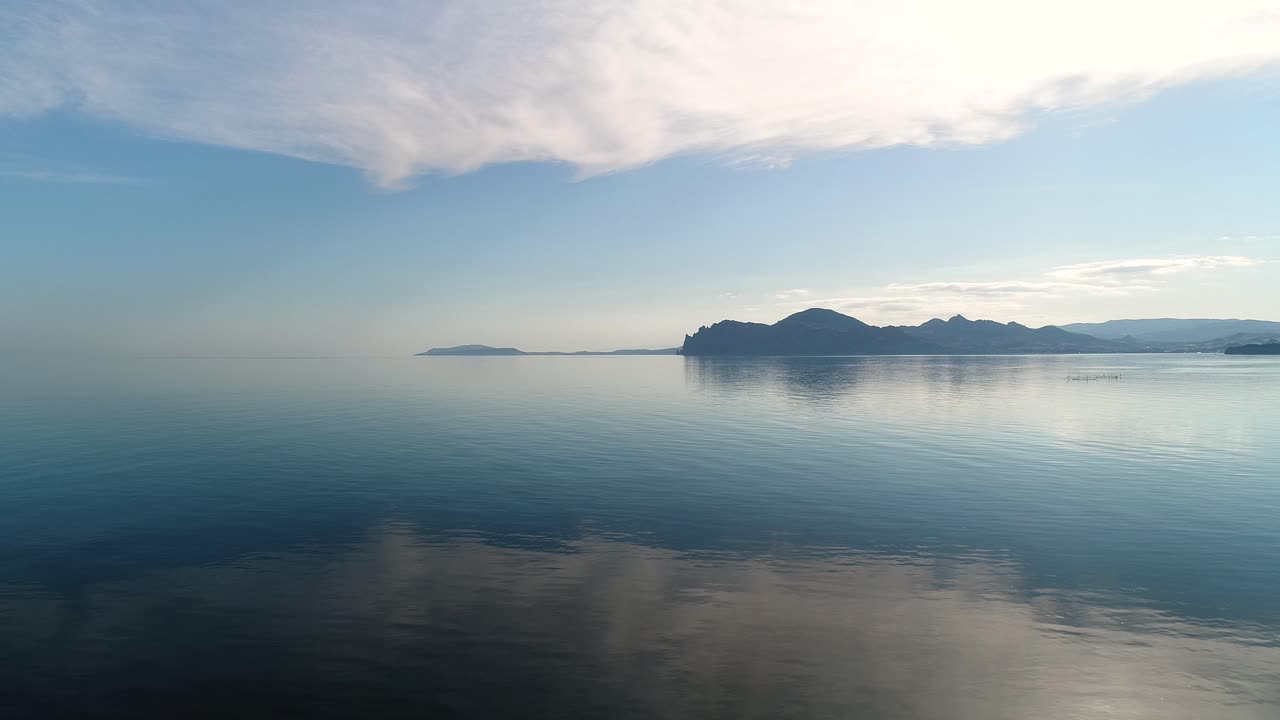 Serene Coastal Landscape with Reflecting Water