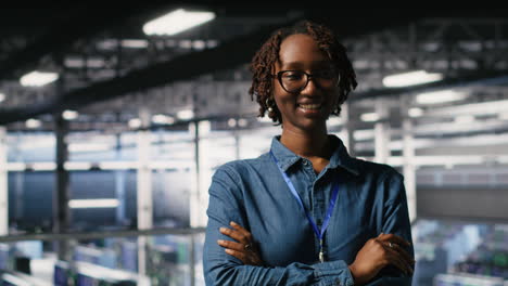 portrait of smiling data center admin next to coworkers