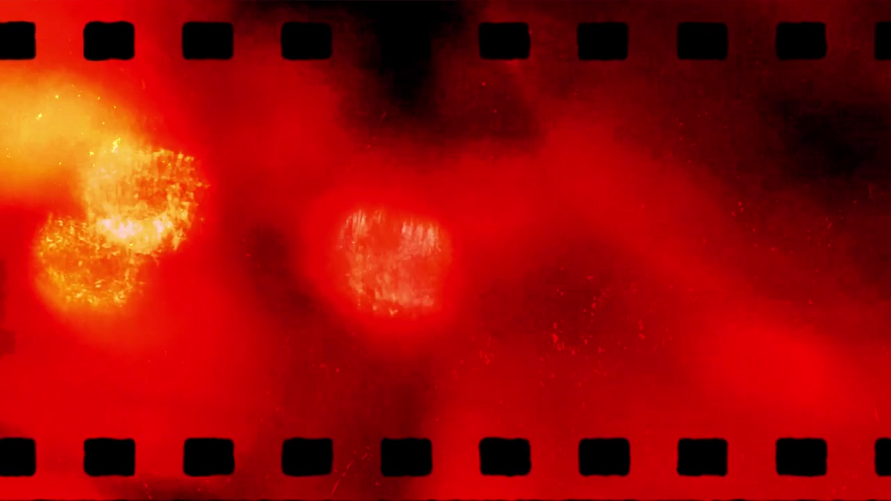 Sovrapposizione di bobina di pellicola vintage con effetti di luce rossa e arancione.
