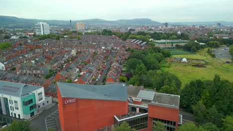 ultra-wide aerial video of the lyric theatre in south belfast, northern ireland in the uk. filmed in 4k, 60fps and with rec709 color