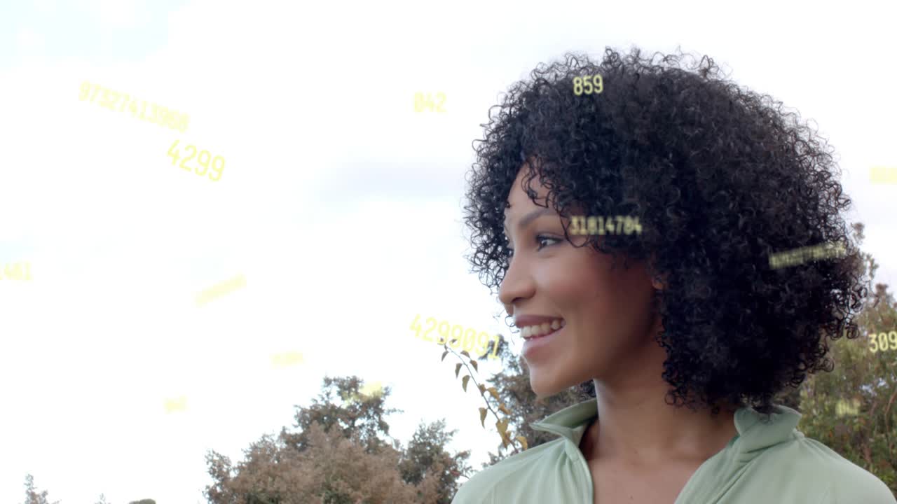 Woman turning head and laughing outdoors, reacting to drifting yellow numeric overlay for marketing