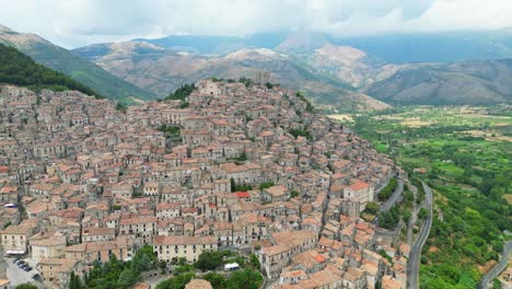 historical, medieval and moorish town morano calabro on a hilltop in calabria, italy - aerial 4k circling