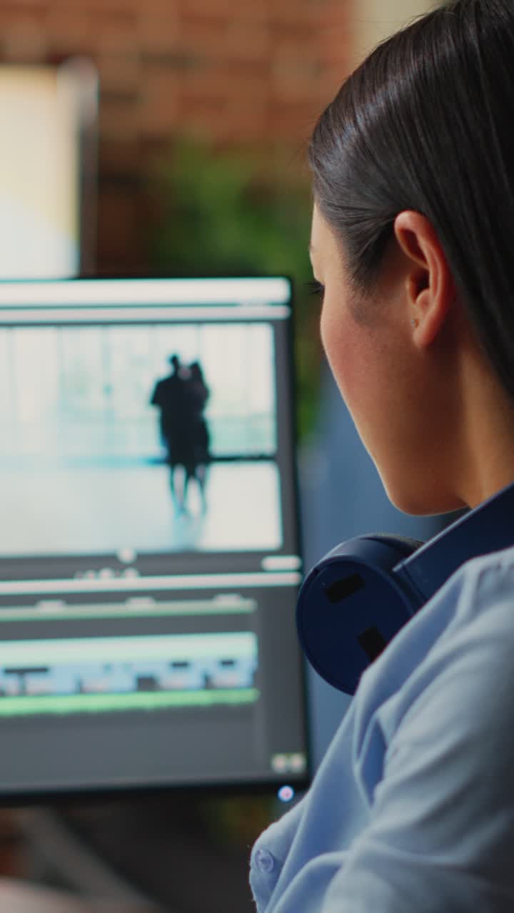 Vertical video: Young content creator editing video and audio montage on computers