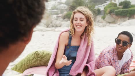 front view of caucasian woman singing song with friends at beach 4k