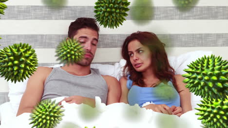 animation of green corona virus with sick couple in background