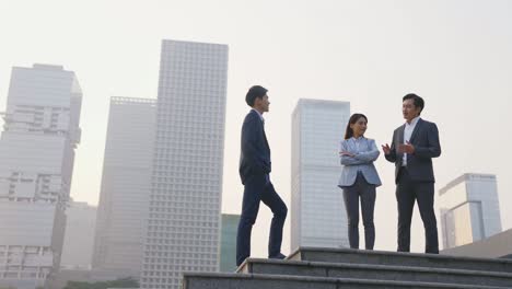 asian business people talking outdoors