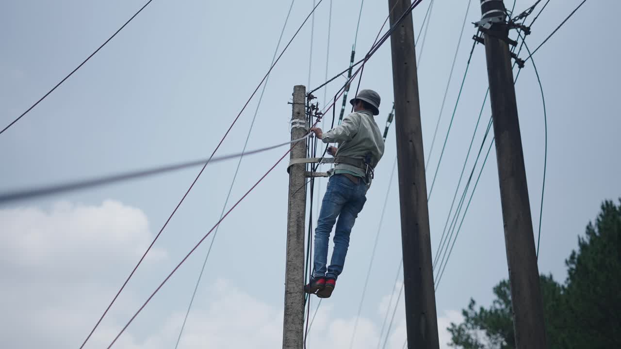 Utility Worker Repairing Power Lines