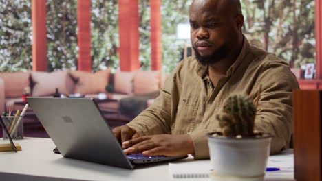 self employed analyst working on financial audits and budget planning on laptop