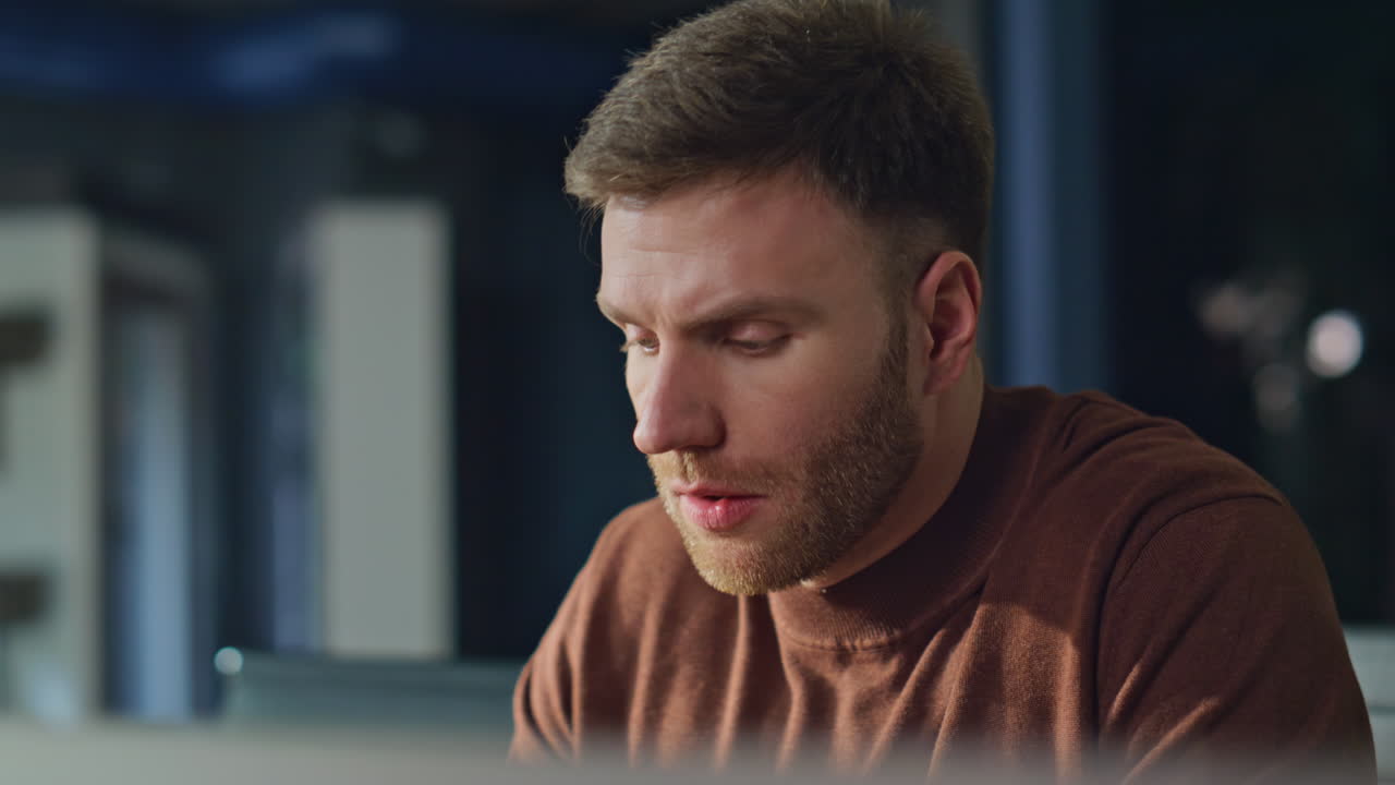 Serious finansier reading papers in office closeup. Man analyzing documents