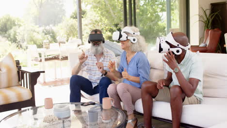 using vr headsets, senior friends enjoying virtual reality experience on sofa