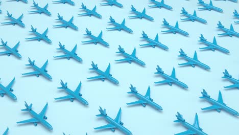 4k loop blue pattern planes in the blue background. perspective view. minimal isometric. aircraft travel concept. geometric shape in pastel colors. sideways movement. 3d rendering animation