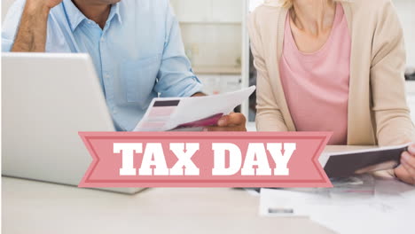 animation of tax day text over worried caucasian man and woman paying bills