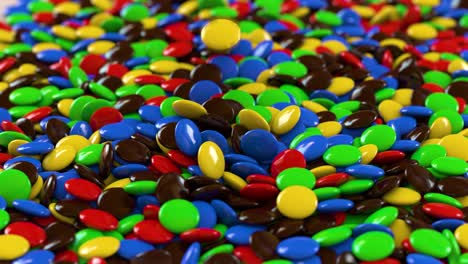 round multicolored candies fall on the pile