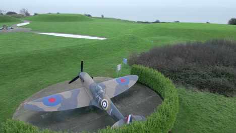 Aerial-view-over-Capel-le-Ferne-down-two-earth-downed-aircraft-in-Battle-of-Britain-garden-memorial