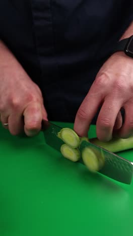 chef slicing leeks