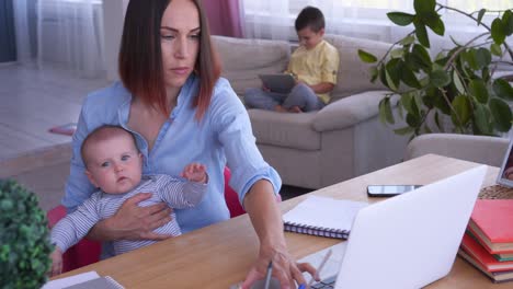 modern woman working at home with children