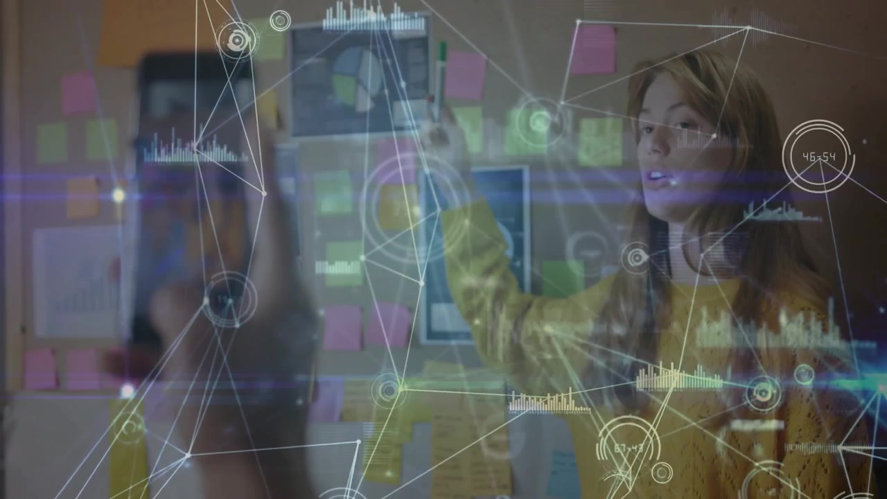 Woman lead pointing at notes wall; peer scanning phone causing AR nodes marking charts for planning