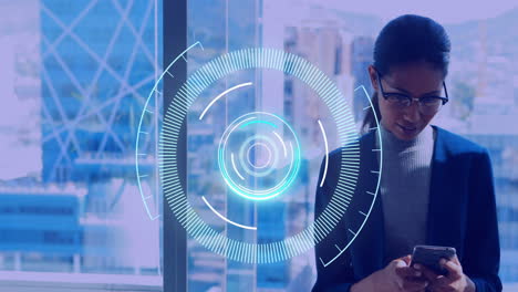 neon round scanner against businesswoman using smartphone at office