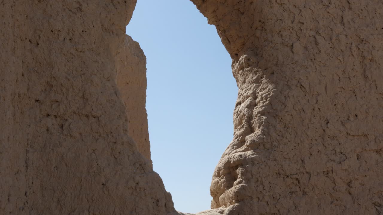 Close up view weathered ancient mud brick ruins with window in Ancient Merv, Turkmenistan