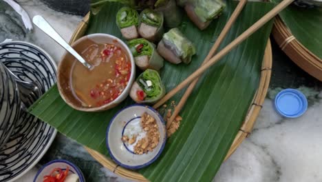 assembling a vietnamese feast on banana leaves