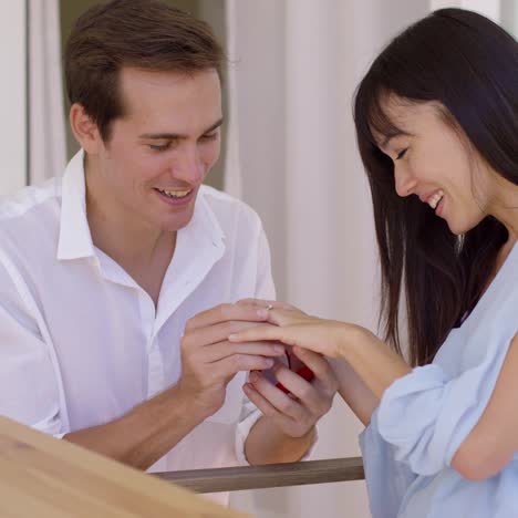 happy young woman accepting a wedding proposal