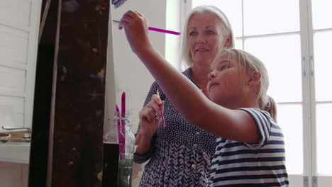 Grandmother-And-Granddaughter-Painting-In-Studio-Shot-On-R3D