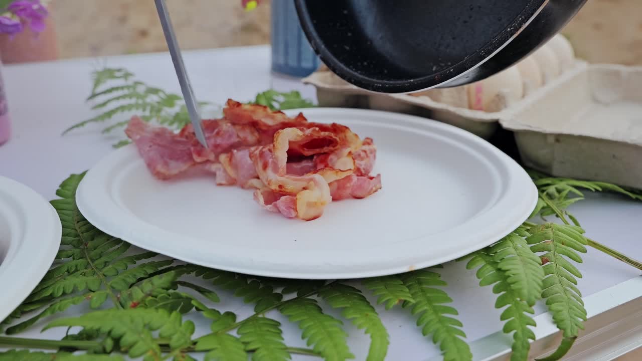 Crispy bacon placed on plate outdoors in Latvia symbolizing resource pressure