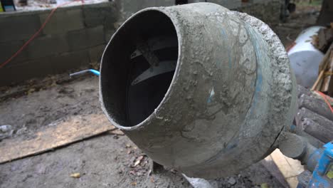 small cement mixer mixing concrete