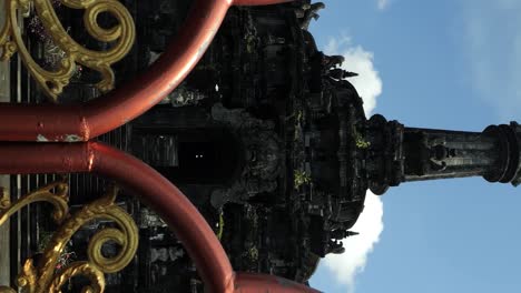 Vertical-Unveiling-shot-capturing-the-radiant-Bajra-Sandhi-Monument-in-Denpasar,-Bali-under-the-clear,-sunny-sky