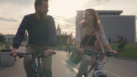 couple cycling in the city