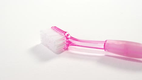 Close-up-of-pink-cleaning-brush