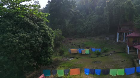 huts on empty sandy beach laundry in the morning