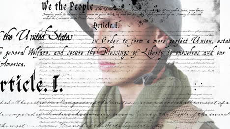 constitution text animation over close-up of person wearing military uniform